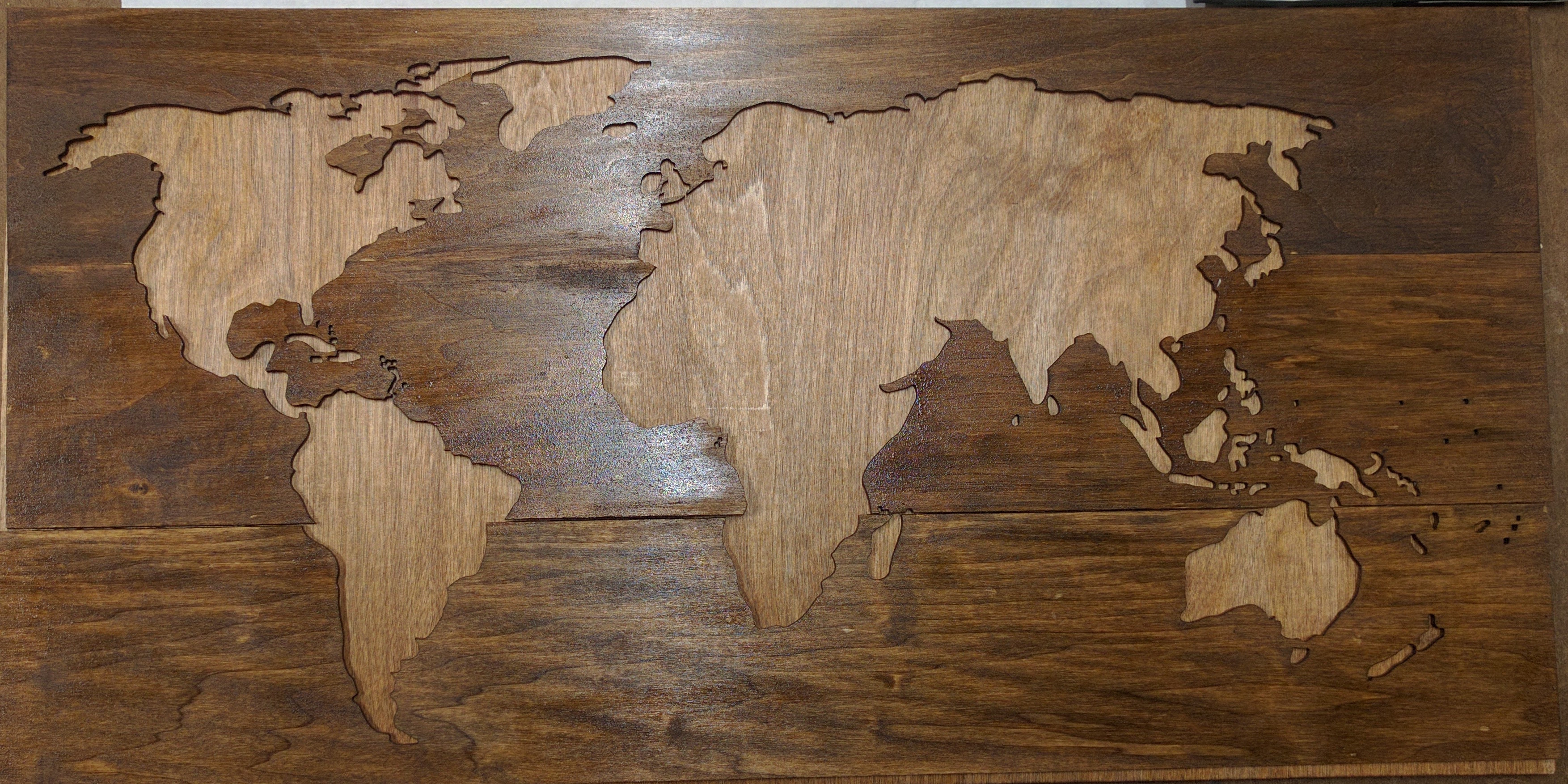 walnut stained bass wood with world map cut out