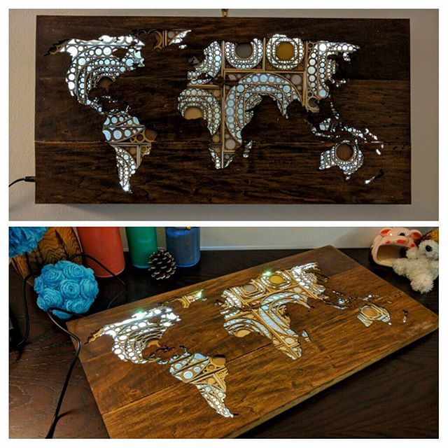 wood and paper laser cut world map.